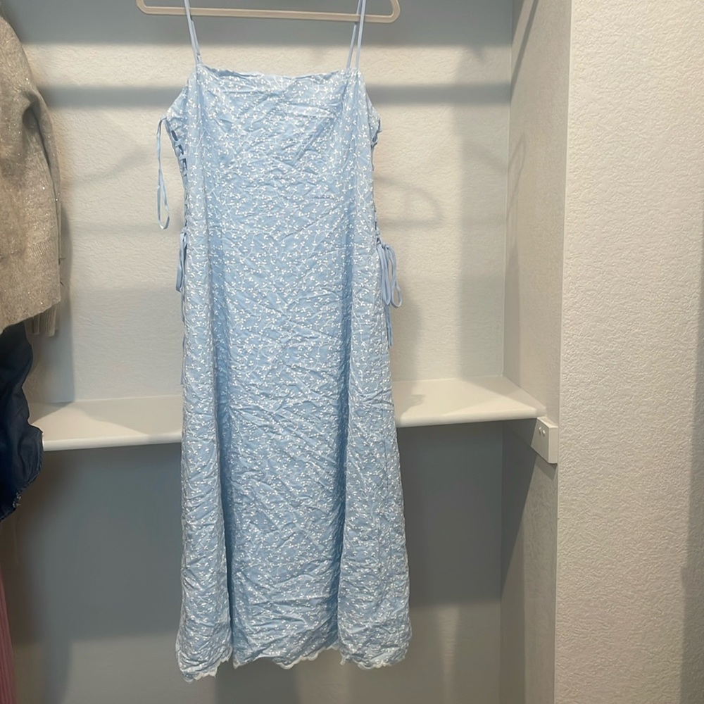 Blue dress with embroidery detail and lace up side